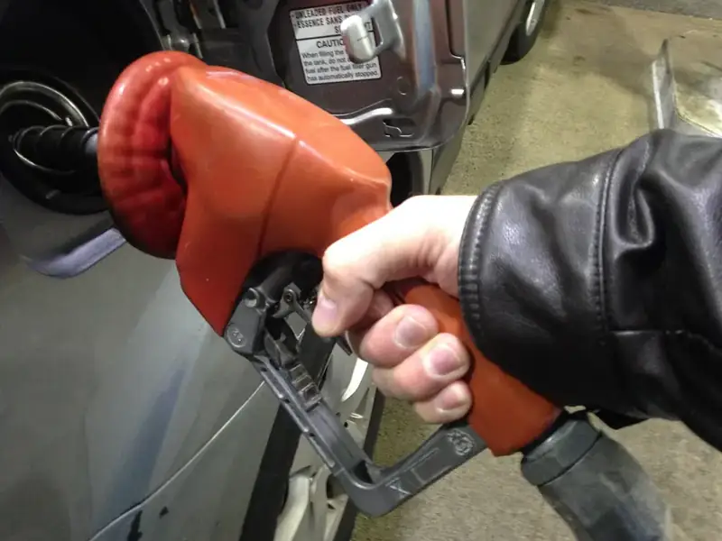 Fuel nozzle being used to fill a vehicle during an emergency fuel delivery