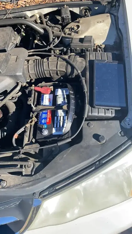 Engine bay and battery terminals during a Free The Key mobile jump start call
